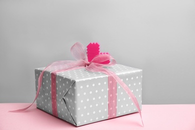 Photo of Elegant gift box for Mother's Day on table