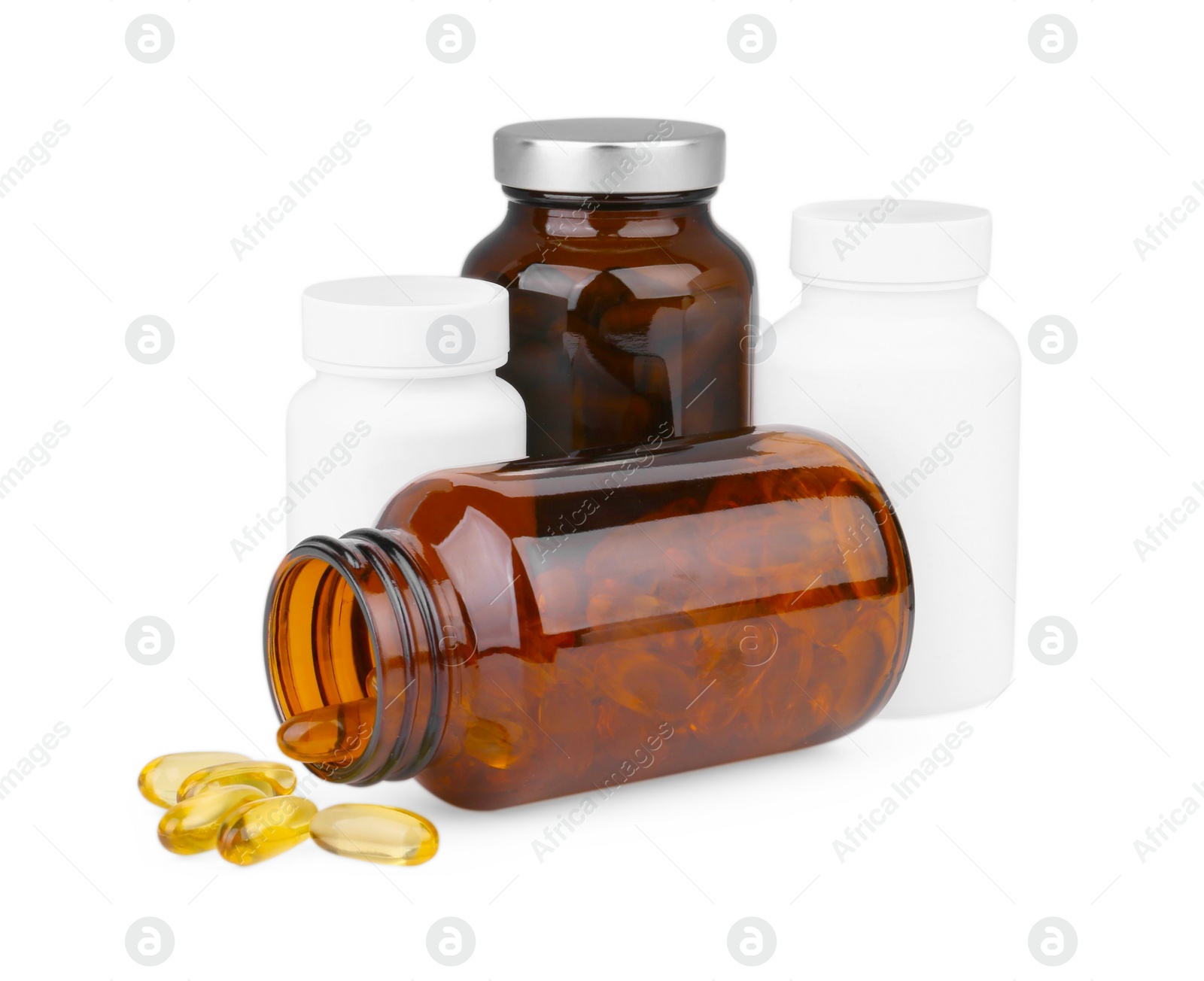 Photo of Vitamin capsules and medical bottles isolated on white