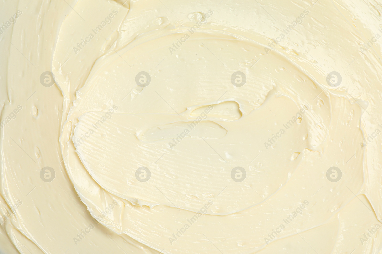 Photo of Texture of tasty butter as background, top view