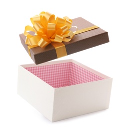 Photo of Open empty gift box with bow on white background