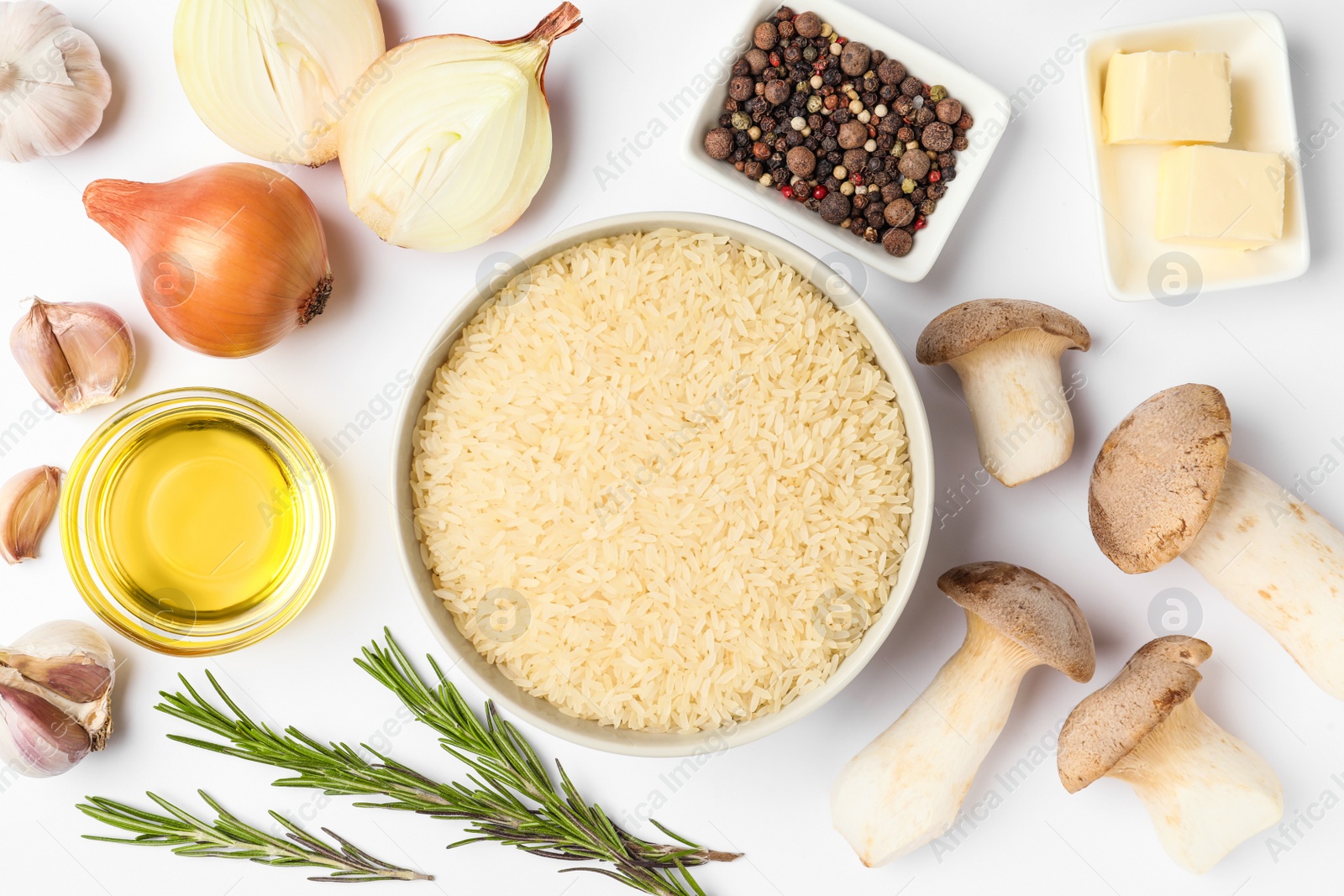 Photo of Different ingredients on white background, top view. Risotto recipe