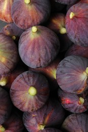 Fresh ripe figs as background, top view