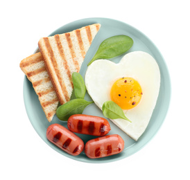 Plate of tasty breakfast with heart shaped fried egg isolated on white, top view