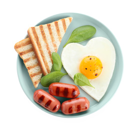 Photo of Plate of tasty breakfast with heart shaped fried egg isolated on white, top view