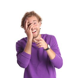 Handsome young man laughing on white background