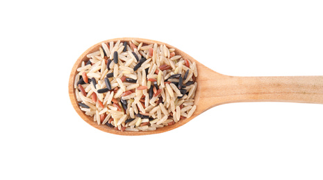 Photo of Mix of different brown rice in wooden spoon isolated on white, top view