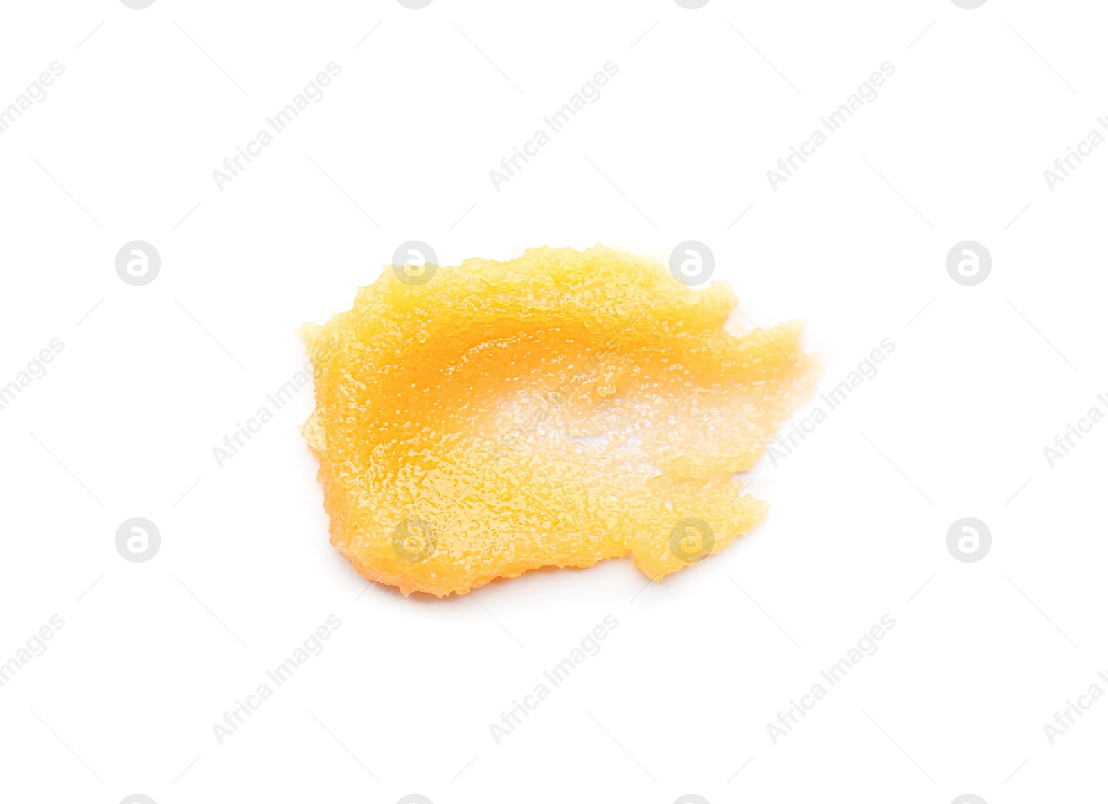 Photo of Smear of orange body scrub isolated on white, top view