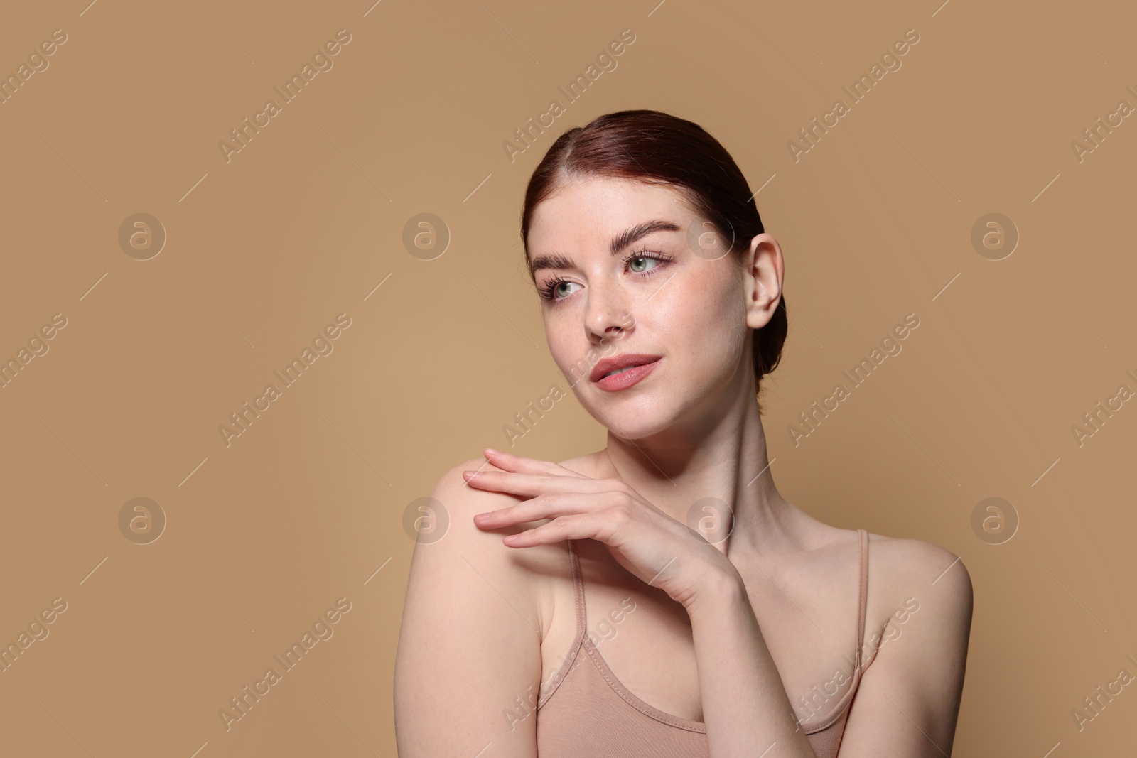 Photo of Portrait of beautiful woman on beige background. Space for text