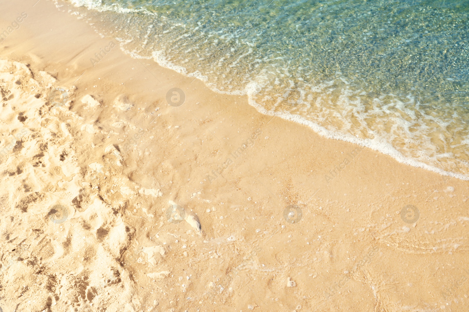 Photo of Sandy beach near sea on sunny day