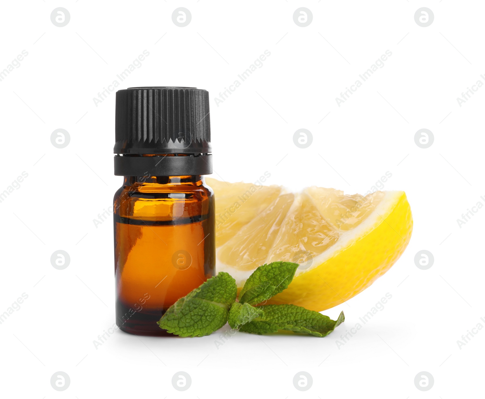 Photo of Bottle of citrus essential oil and cut fresh lemon isolated on white