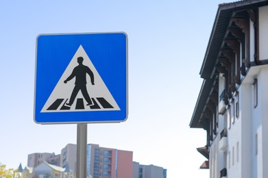 Photo of Post with traffic sign Pedestrian Crossing outdoors, space for text