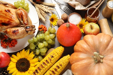 Photo of Flat lay composition with turkey on grey background. Happy Thanksgiving day