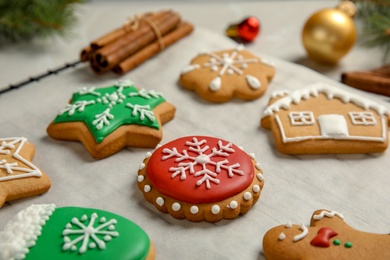 Photo of Tasty homemade Christmas cookies on parchment paper