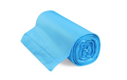 Photo of Roll of turquoise garbage bags on white background. Cleaning supplies