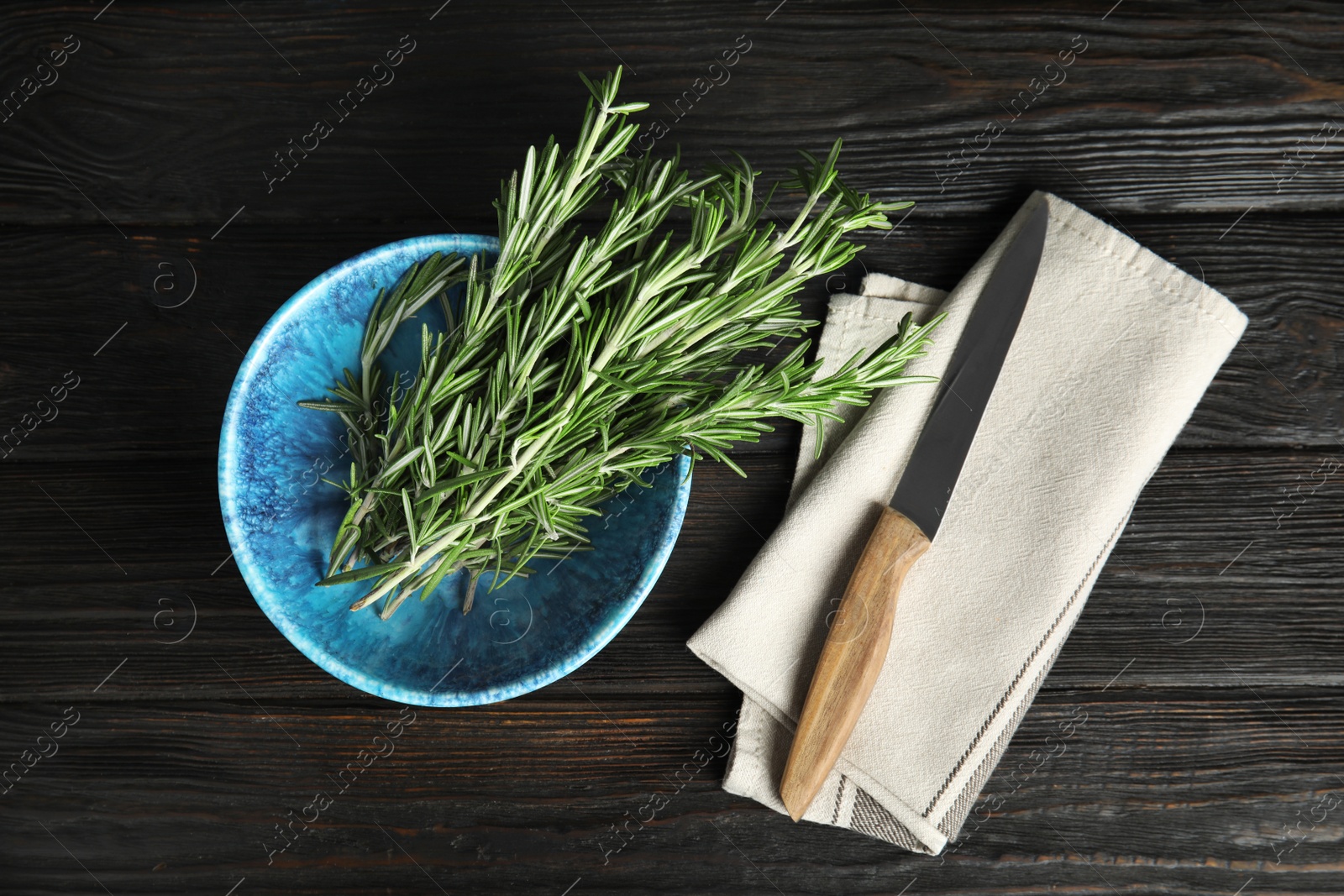 Photo of Flat lay composition with fresh rosemary twigs on wooden table