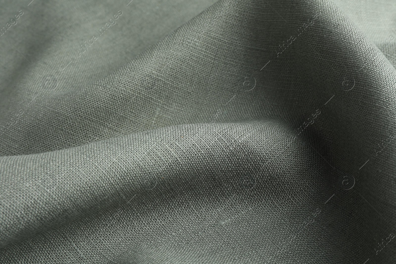 Photo of Texture of grey crumpled fabric as background, closeup