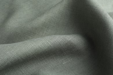 Texture of grey crumpled fabric as background, closeup