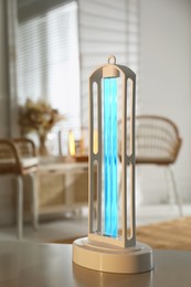 Photo of UV sterilizer lamp on table at home