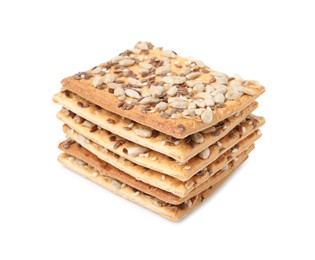 Stack of cereal crackers with flax, sunflower and sesame seeds isolated on white