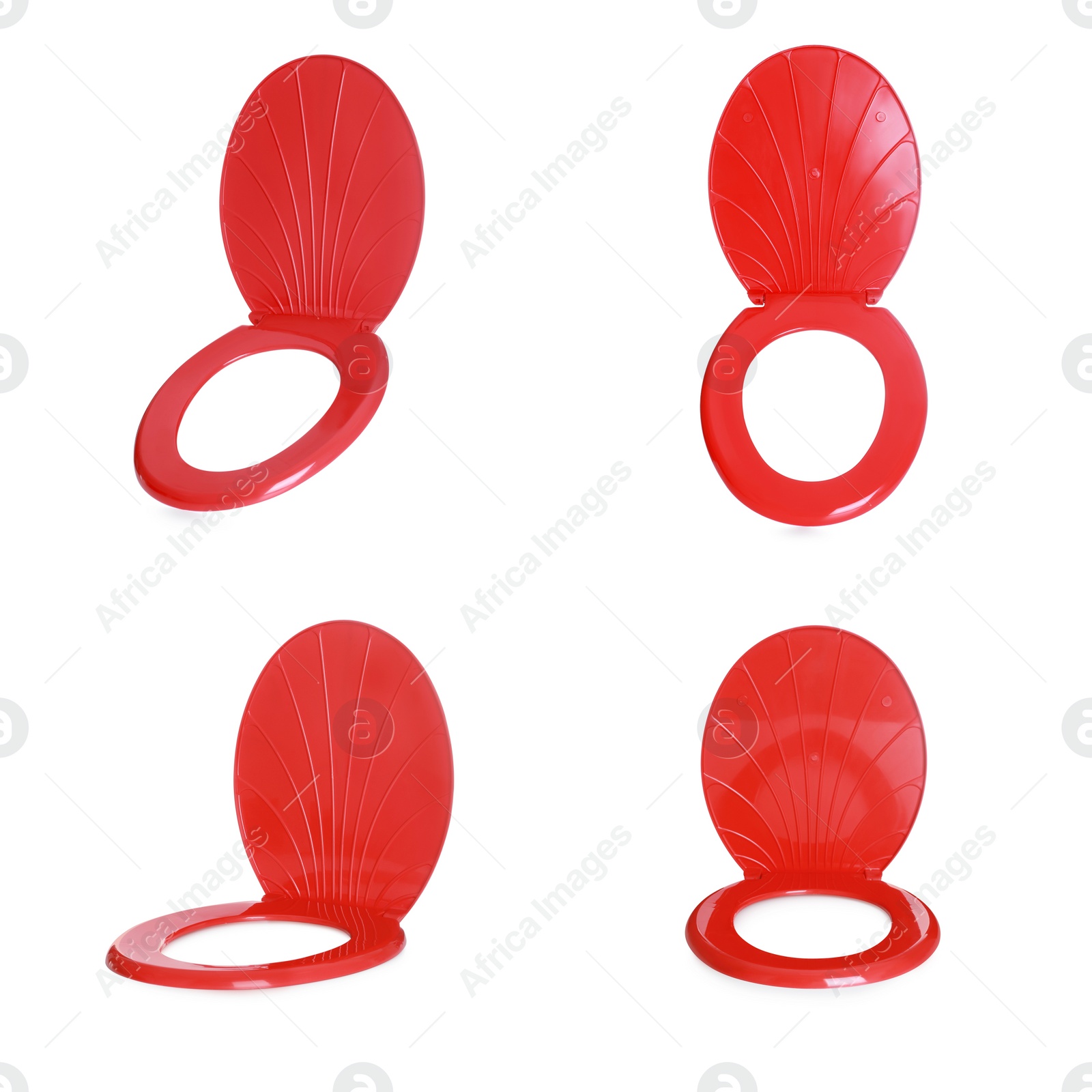 Image of Set with red plastic toilet seats on white background