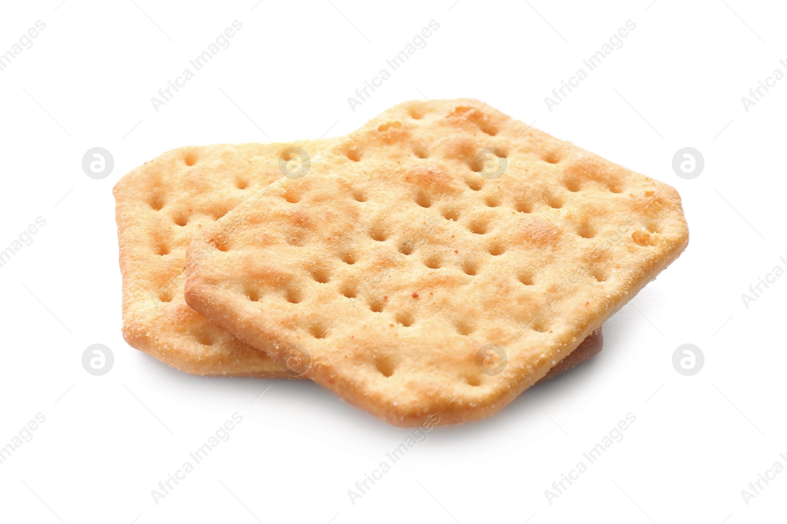 Photo of Crispy crackers isolated on white. Delicious snack