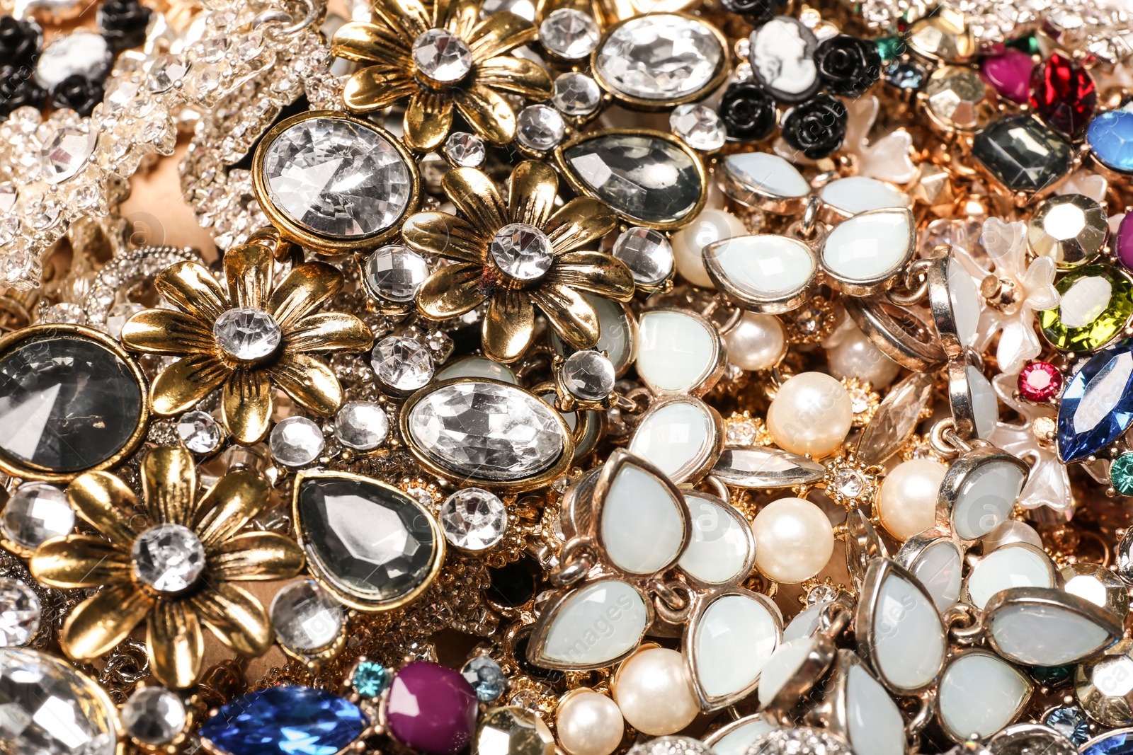 Photo of Different stylish jewelry as background, closeup view