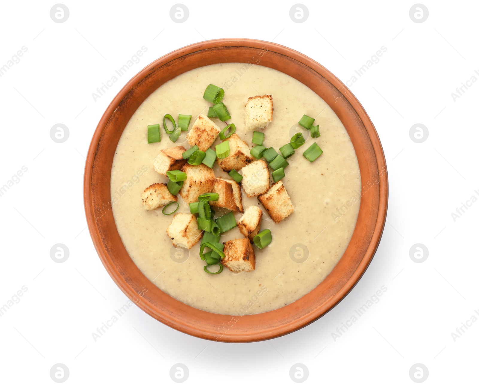 Photo of Bowl of fresh homemade mushroom soup on white background, top view