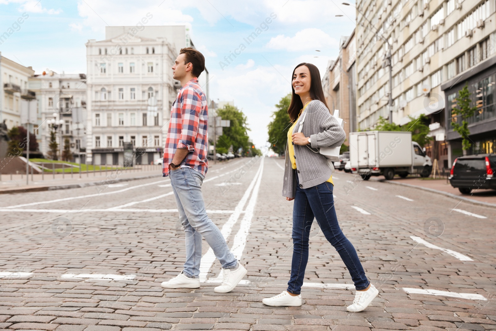 Photo of People crossing street. Traffic rules and regulations