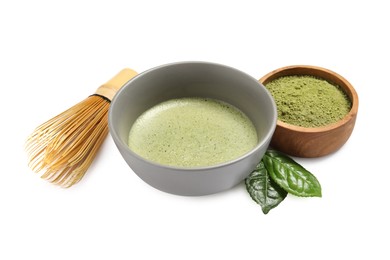 Photo of Cup of fresh matcha tea, bamboo whisk and green powder isolated on white