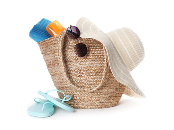 Photo of Bag and beach accessories on white background