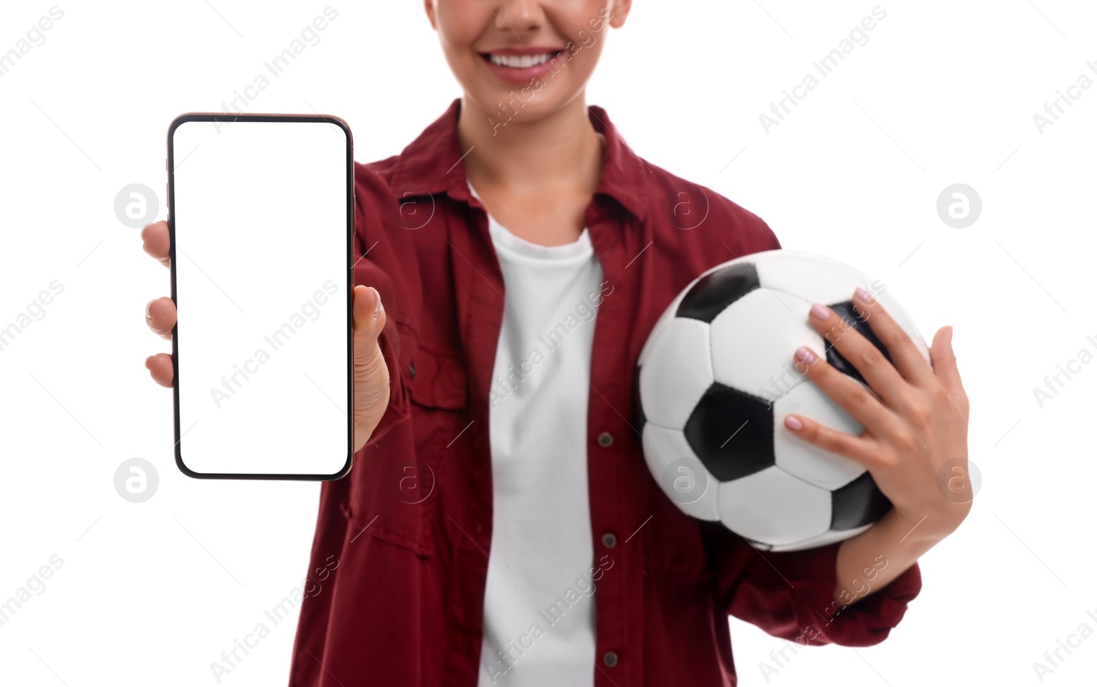 Photo of Happy sports fan with soccer ball and smartphone on white background, closeup