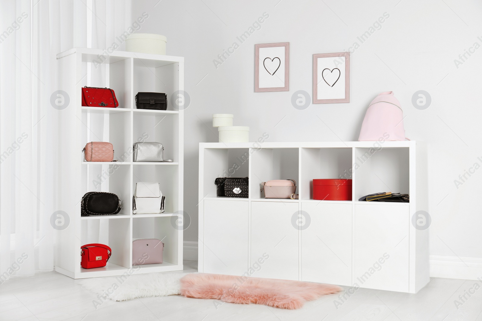 Photo of Wardrobe shelves with different stylish bags indoors. Idea for interior design