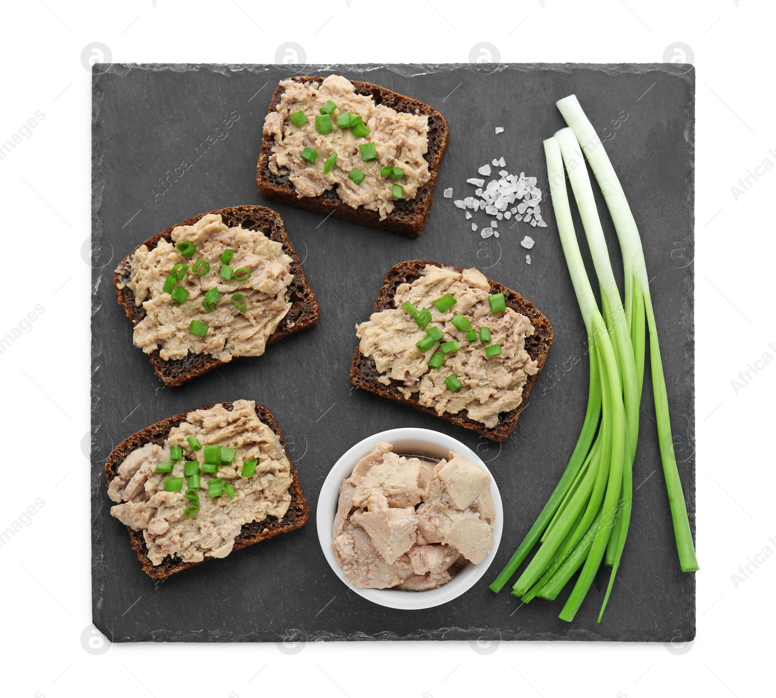 Photo of Tasty sandwiches with cod liver, salt and green onion isolated on white, top view