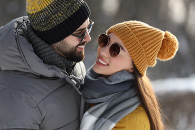 Beautiful happy couple outdoors on winter day