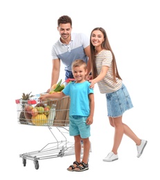 Photo of Happy family with full shopping cart on white background