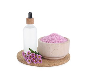 Bowl of pink sea salt, bottle with essential oil and beautiful chrysanthemum flowers isolated on white