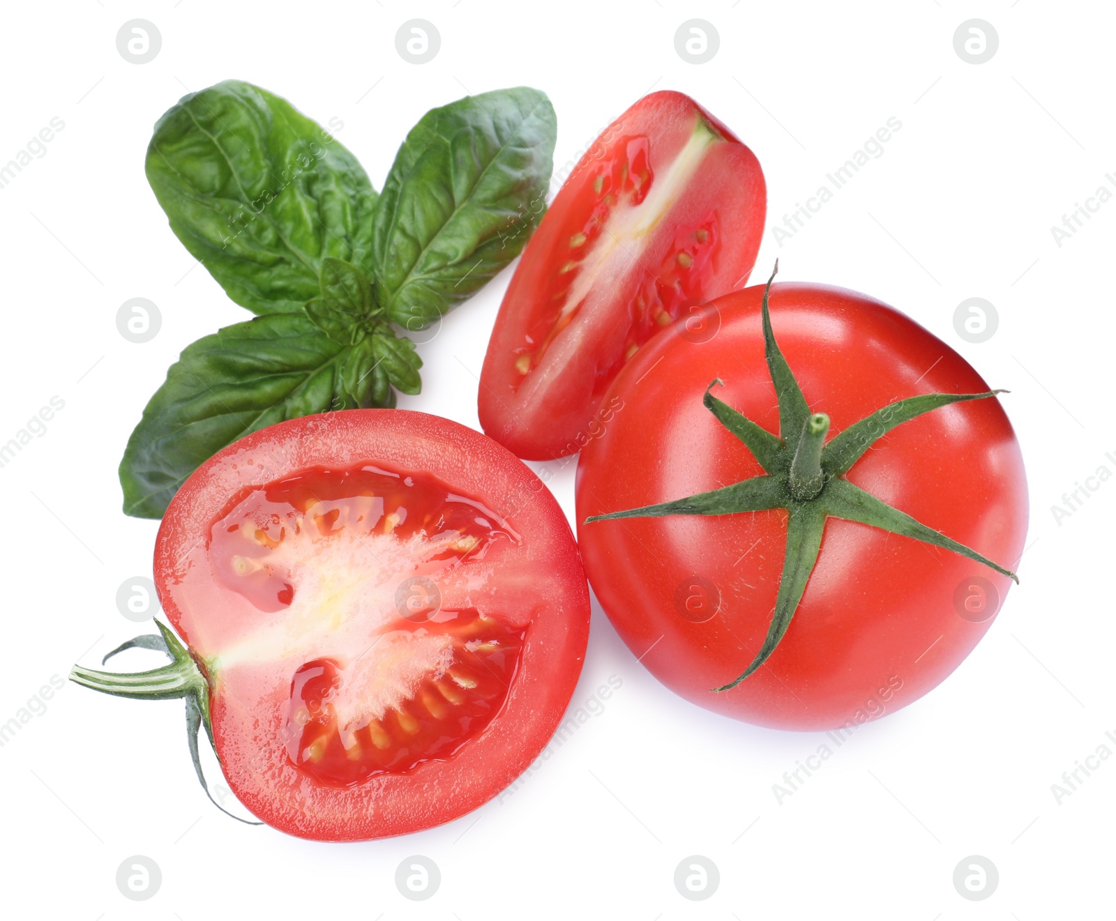 Photo of Fresh green basil leaves with cut and whole tomatoes on white background, top view