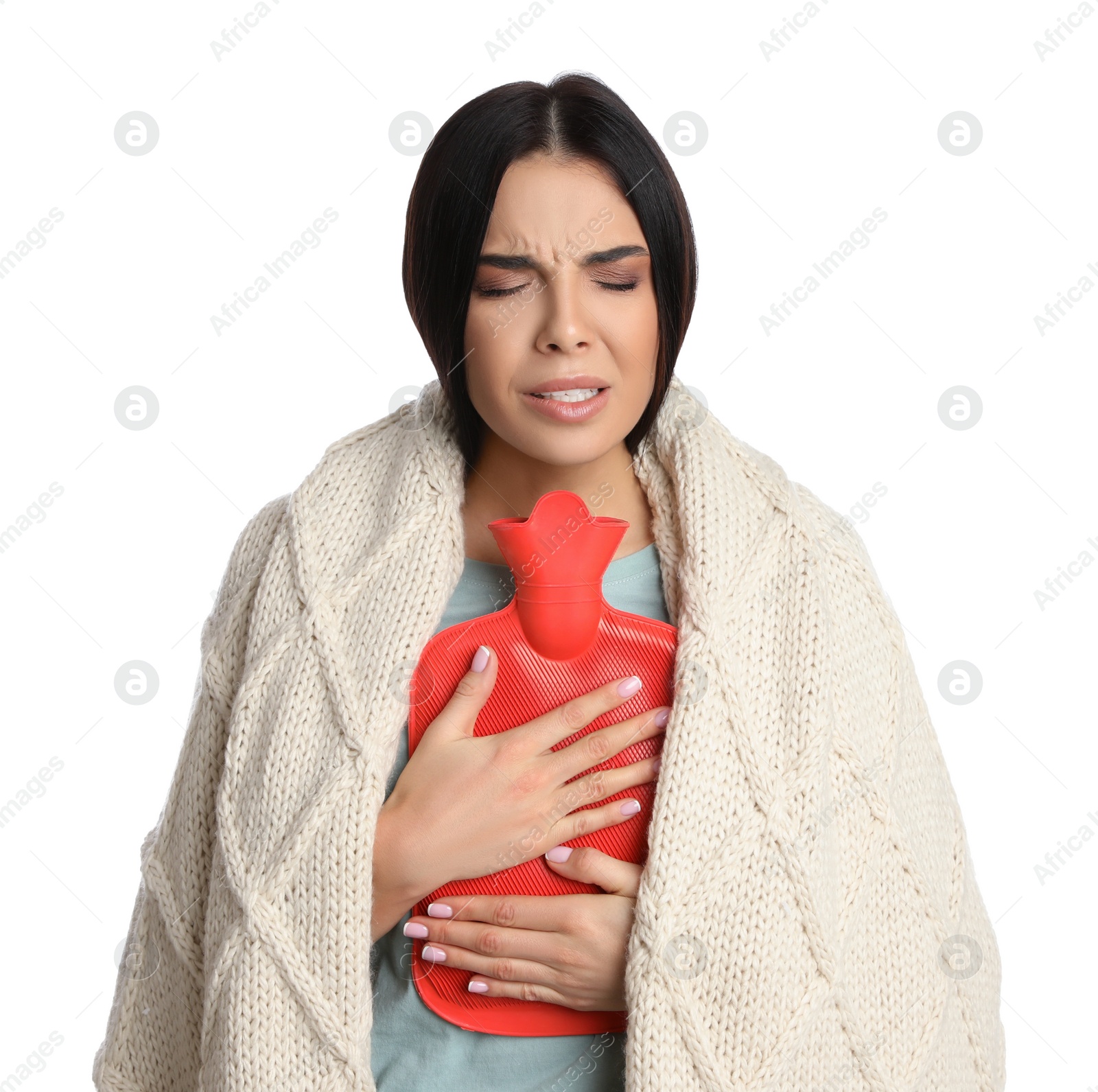 Photo of Woman using hot water bottle to relieve chest pain on white background