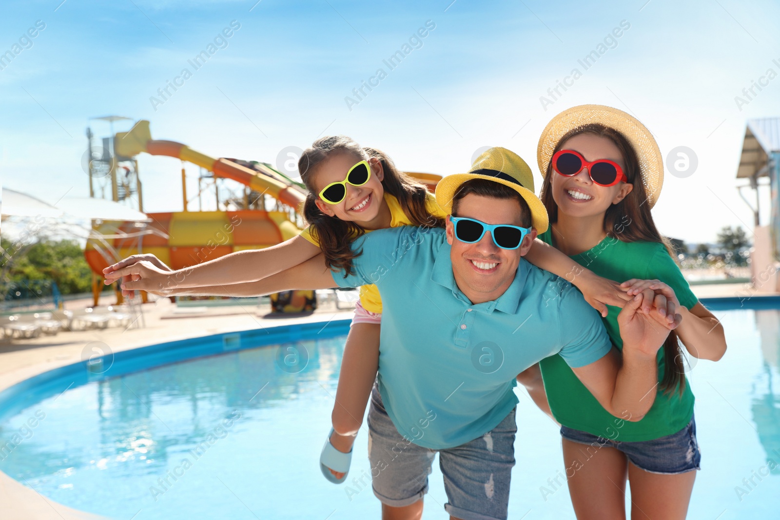 Photo of Happy family at water park. Summer vacation