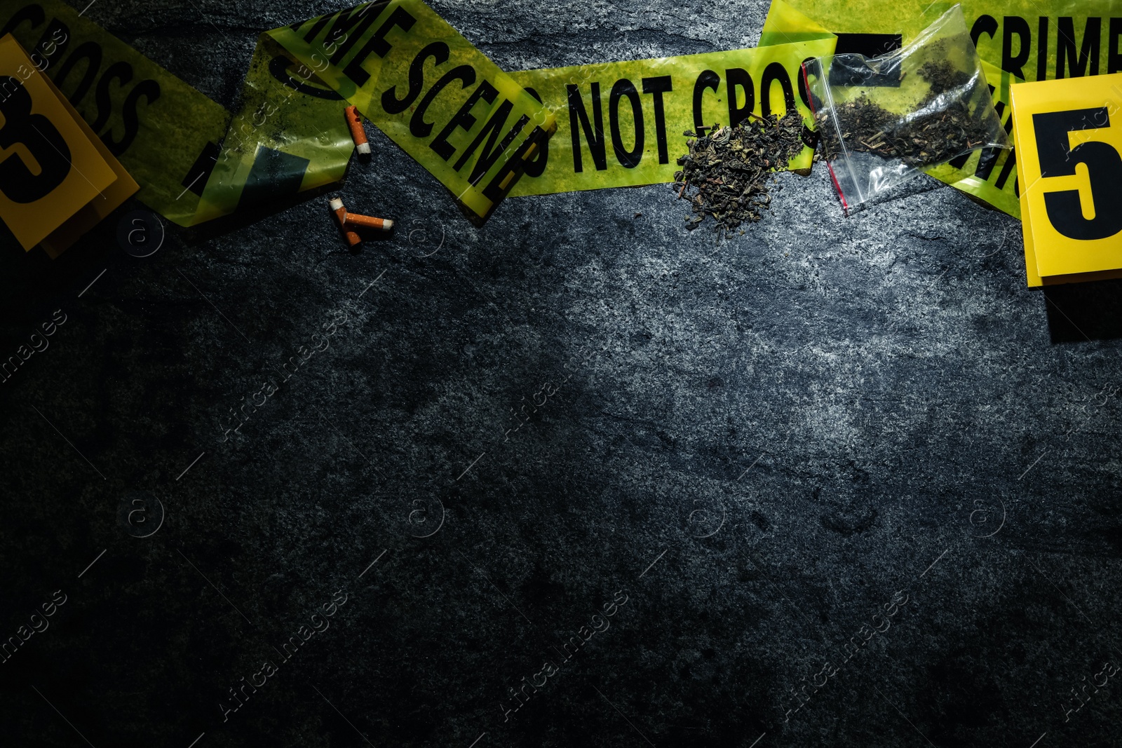 Photo of Flat lay composition with evidences and crime scene tape on grey stone background, space for text