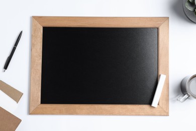 Photo of Flat lay composition with small chalkboard on white background, space for text