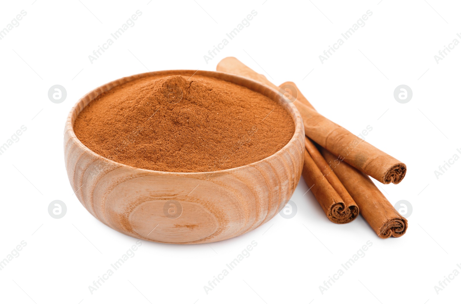 Photo of Aromatic cinnamon sticks and bowl with powder on white background