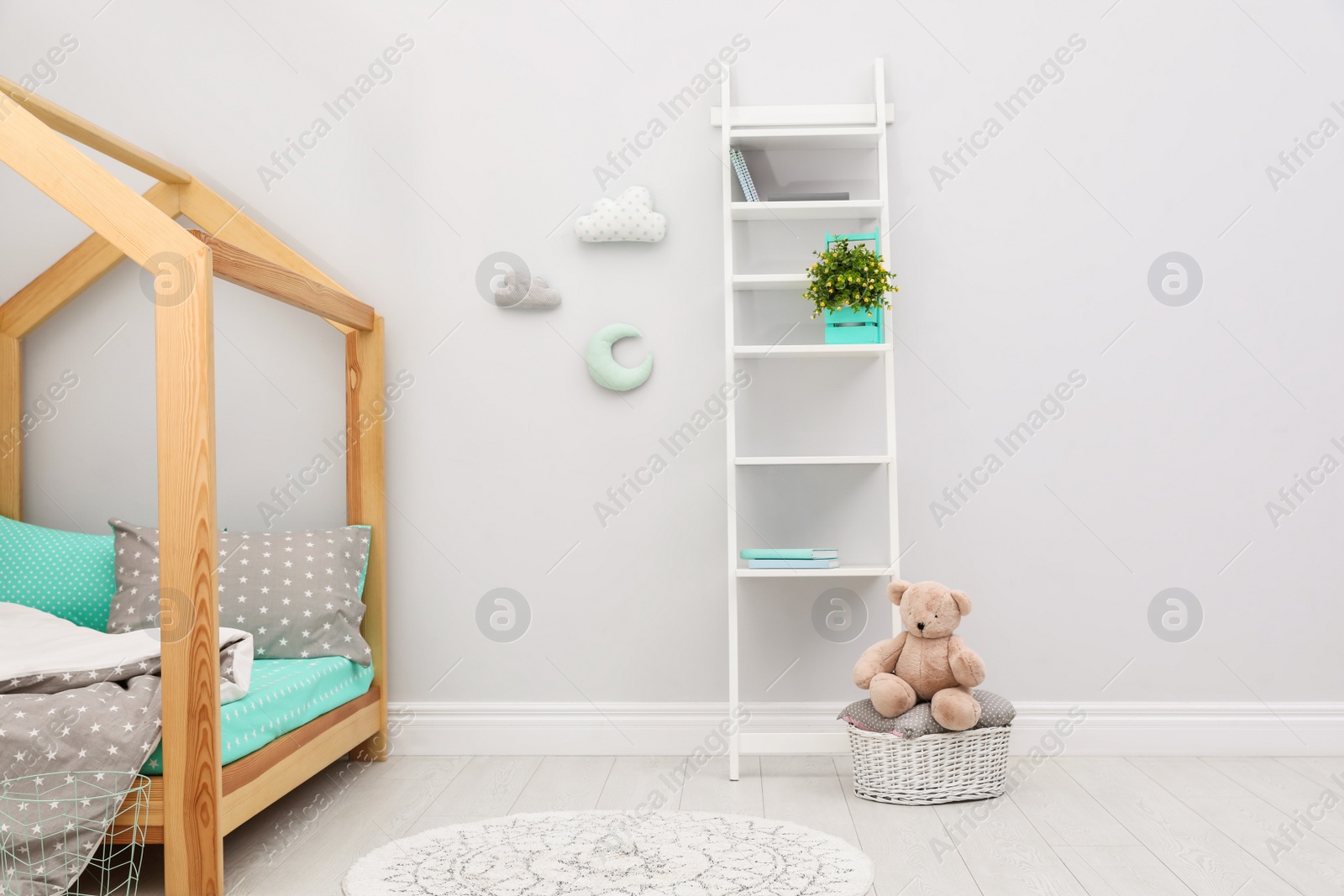 Photo of Stylish child room interior with comfortable bed
