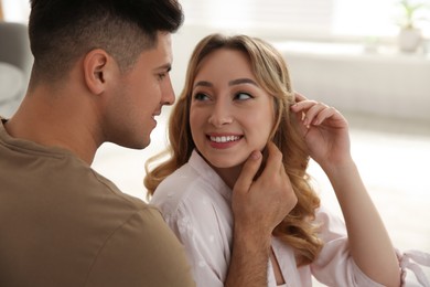 Photo of Lovely couple enjoying time together at home