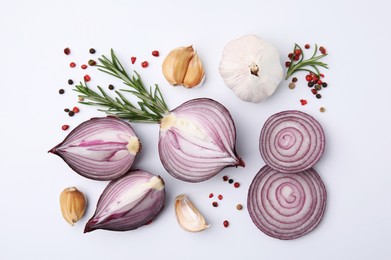 Fresh red onions, garlic, rosemary and spices on white background, flat lay