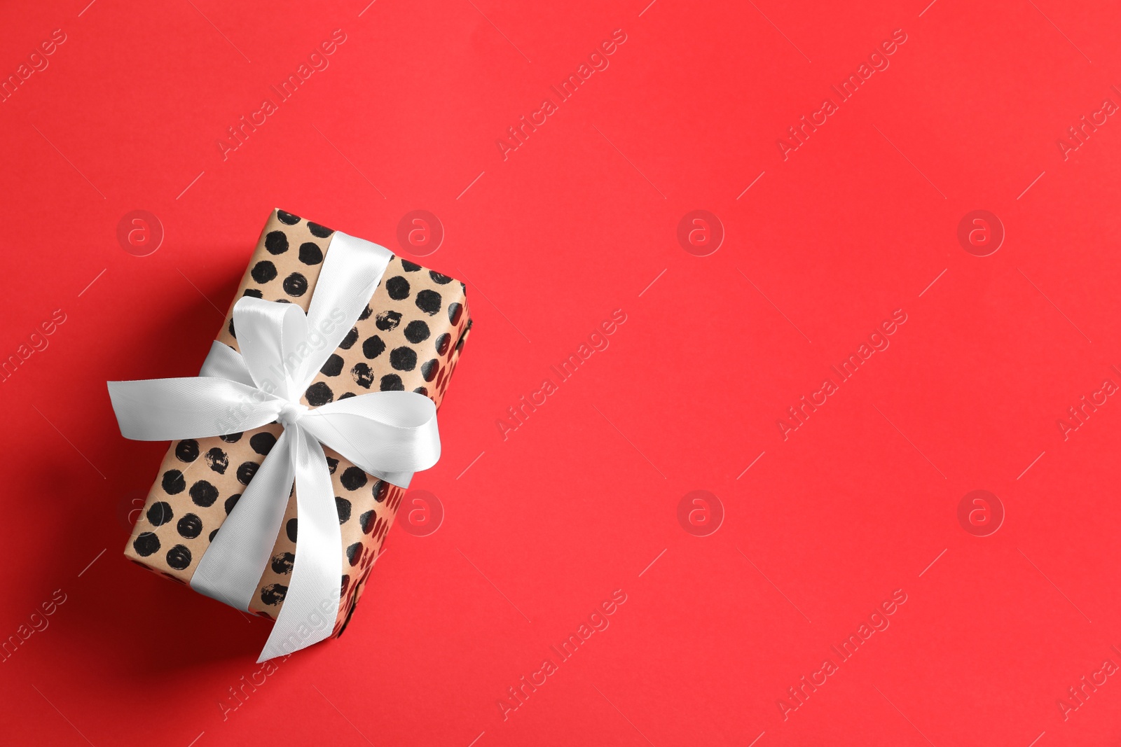 Photo of Beautiful gift box on color background, top view