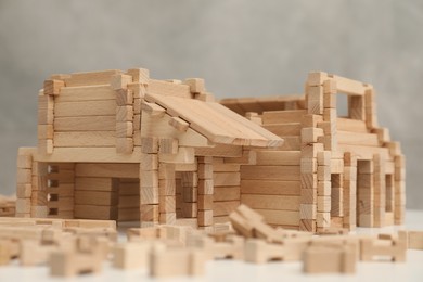 Photo of Wooden construction set on white table, closeup. Children's toy