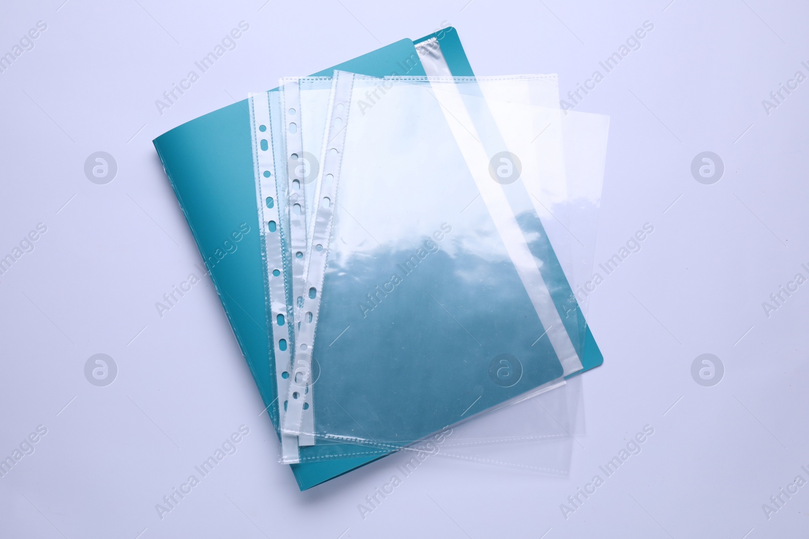 Photo of File folder with punched pockets isolated on white, top view