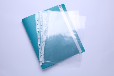 File folder with punched pockets isolated on white, top view