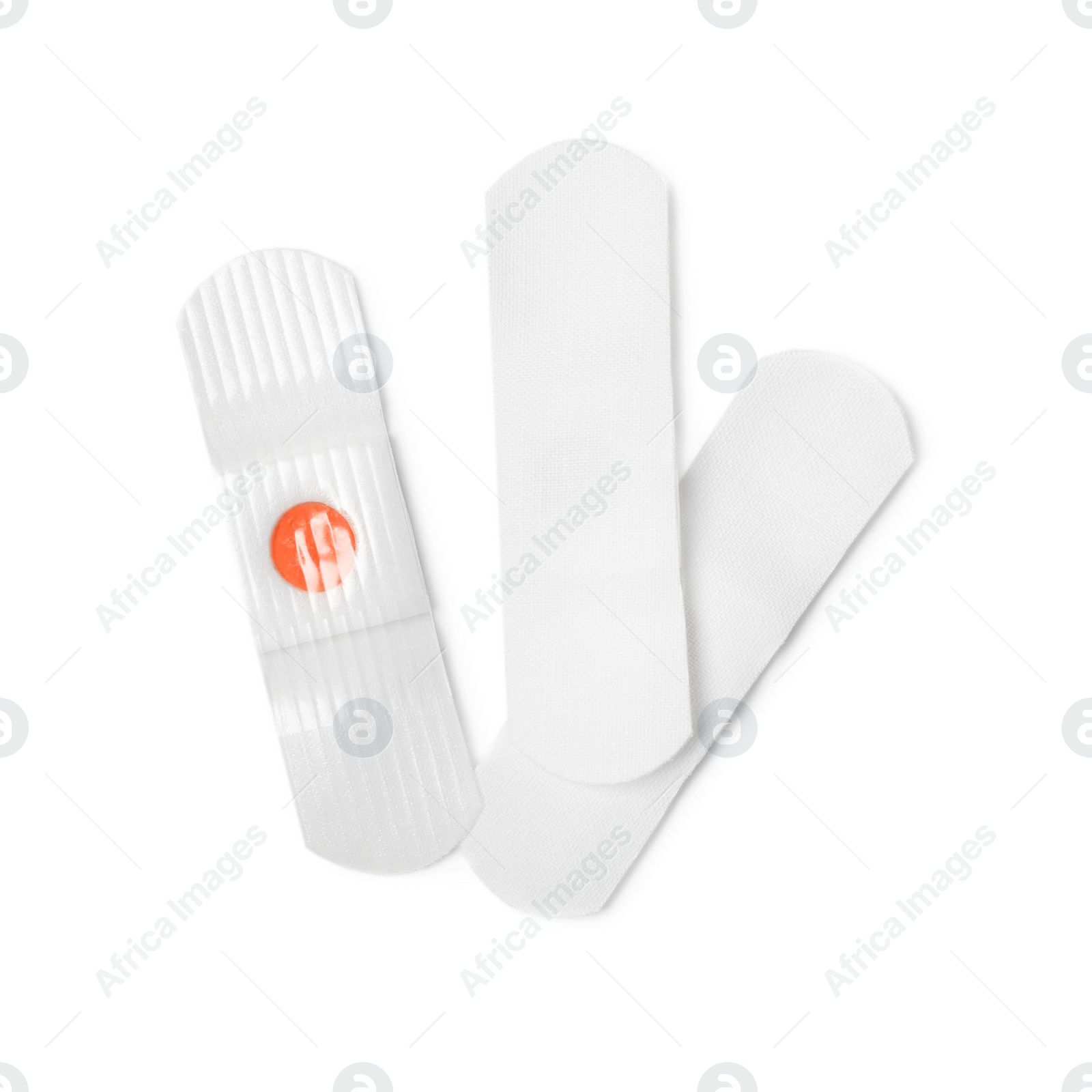 Medical sticking plasters isolated on white. First aid item Photo of Medical sticking plasters isolated on white. First aid item